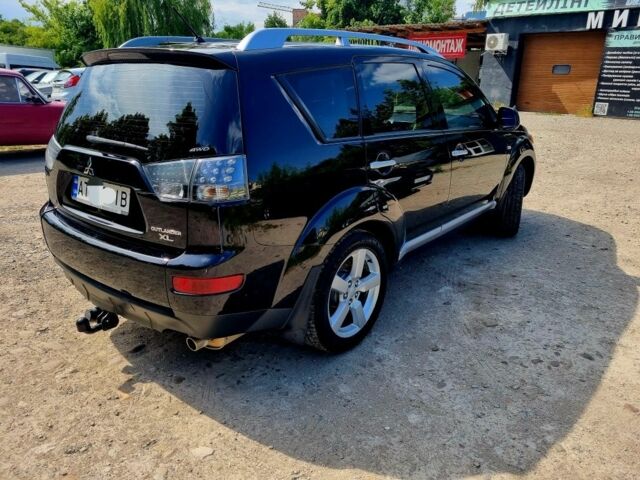 Черный Мицубиси Аутлендер, объемом двигателя 2.4 л и пробегом 234 тыс. км за 9800 $, фото 3 на Automoto.ua