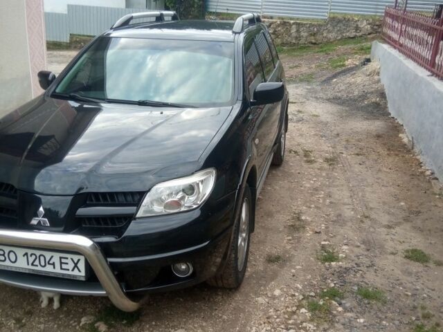 Чорний Міцубісі Аутлендер, об'ємом двигуна 2 л та пробігом 208 тис. км за 6700 $, фото 10 на Automoto.ua