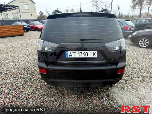 Черный Мицубиси Аутлендер, объемом двигателя 2.4 л и пробегом 200 тыс. км за 9999 $, фото 4 на Automoto.ua