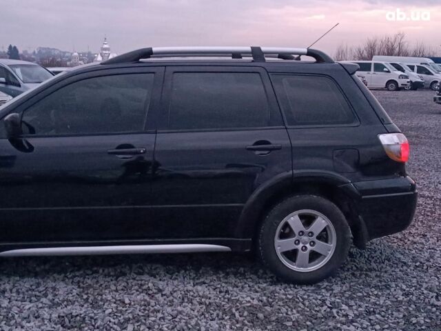 Черный Мицубиси Аутлендер, объемом двигателя 2 л и пробегом 271 тыс. км за 6940 $, фото 4 на Automoto.ua