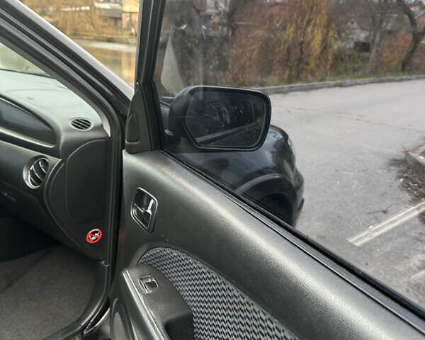 Чорний Міцубісі Аутлендер, об'ємом двигуна 2 л та пробігом 118 тис. км за 8100 $, фото 24 на Automoto.ua