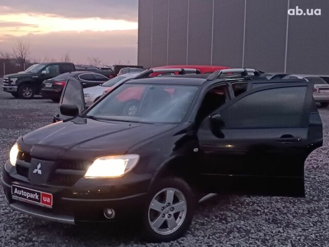 Черный Мицубиси Аутлендер, объемом двигателя 2 л и пробегом 271 тыс. км за 6940 $, фото 23 на Automoto.ua