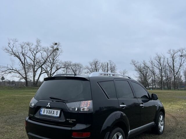 Черный Мицубиси Аутлендер, объемом двигателя 2.4 л и пробегом 230 тыс. км за 8800 $, фото 2 на Automoto.ua