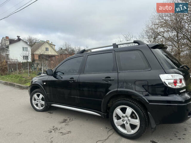 Чорний Міцубісі Аутлендер, об'ємом двигуна 2 л та пробігом 118 тис. км за 8100 $, фото 14 на Automoto.ua
