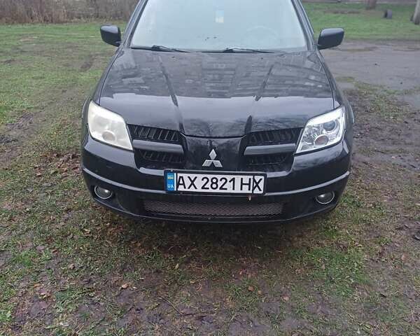 Черный Мицубиси Аутлендер, объемом двигателя 2.4 л и пробегом 270 тыс. км за 6700 $, фото 4 на Automoto.ua