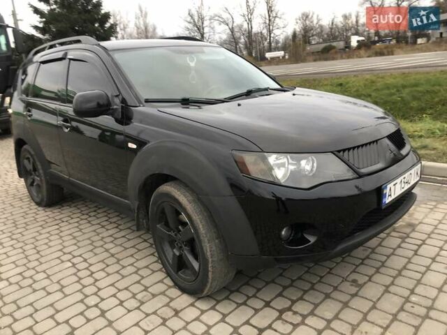 Чорний Міцубісі Аутлендер, об'ємом двигуна 2.4 л та пробігом 199 тис. км за 8999 $, фото 7 на Automoto.ua