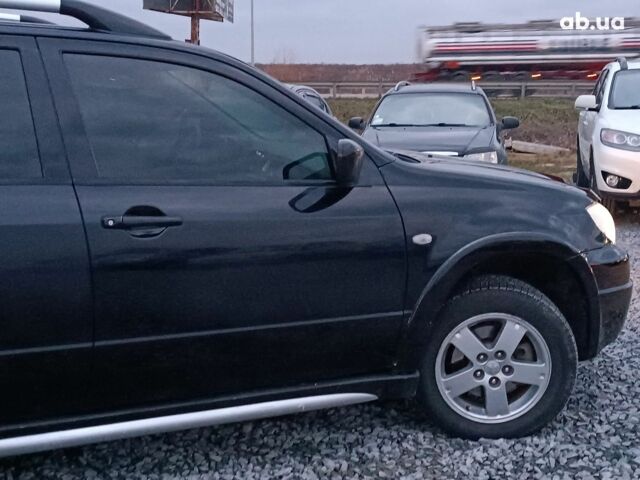 Черный Мицубиси Аутлендер, объемом двигателя 2 л и пробегом 271 тыс. км за 6940 $, фото 10 на Automoto.ua