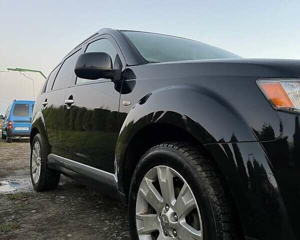 Черный Мицубиси Аутлендер, объемом двигателя 2.2 л и пробегом 310 тыс. км за 9700 $, фото 5 на Automoto.ua