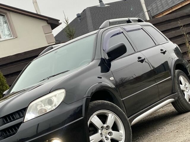 Черный Мицубиси Аутлендер, объемом двигателя 2.4 л и пробегом 178 тыс. км за 6900 $, фото 9 на Automoto.ua