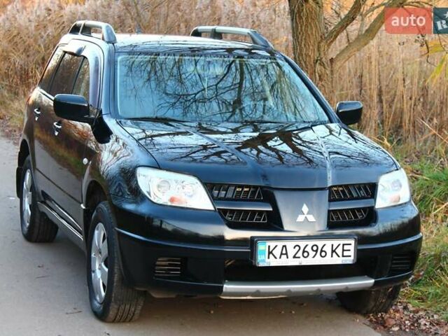 Черный Мицубиси Аутлендер, объемом двигателя 2 л и пробегом 190 тыс. км за 6900 $, фото 33 на Automoto.ua
