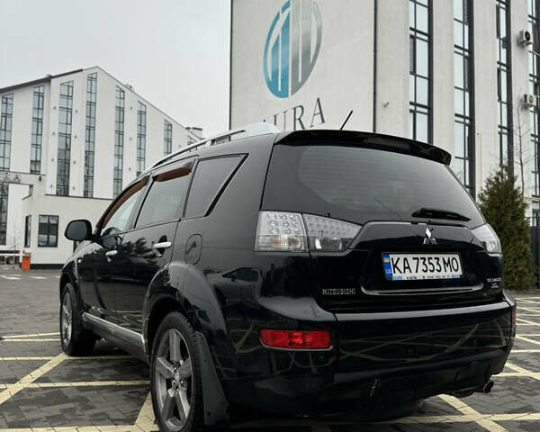 Черный Мицубиси Аутлендер, объемом двигателя 2.36 л и пробегом 120 тыс. км за 10100 $, фото 4 на Automoto.ua
