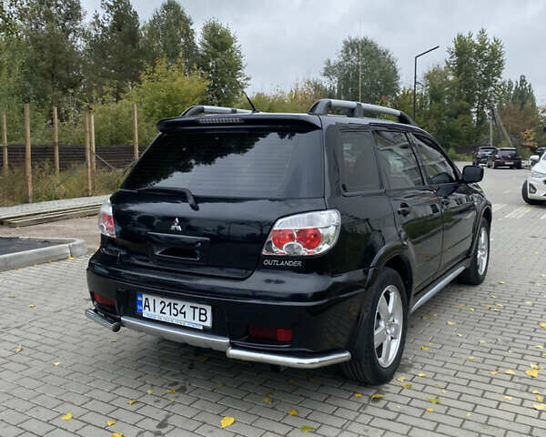 Чорний Міцубісі Аутлендер, об'ємом двигуна 2.38 л та пробігом 252 тис. км за 7200 $, фото 6 на Automoto.ua