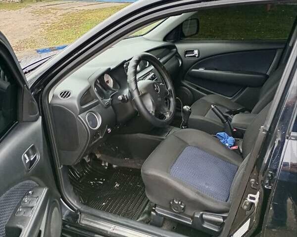 Черный Мицубиси Аутлендер, объемом двигателя 2 л и пробегом 209 тыс. км за 5700 $, фото 2 на Automoto.ua