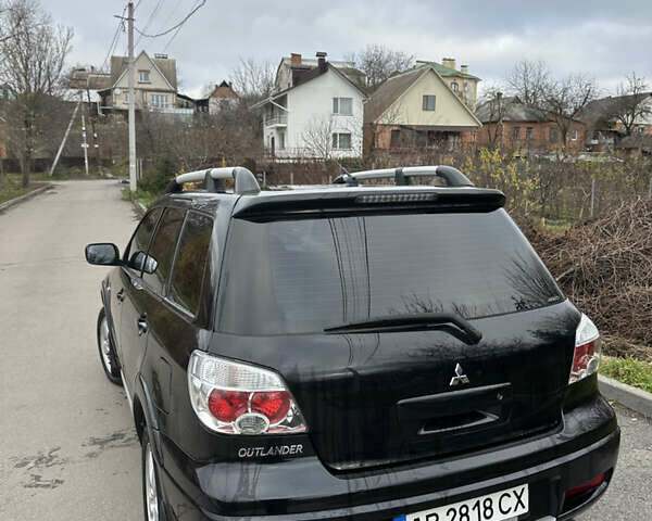 Чорний Міцубісі Аутлендер, об'ємом двигуна 2 л та пробігом 118 тис. км за 8100 $, фото 13 на Automoto.ua