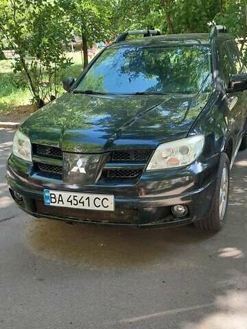 Черный Мицубиси Аутлендер, объемом двигателя 2.4 л и пробегом 150 тыс. км за 6300 $, фото 7 на Automoto.ua