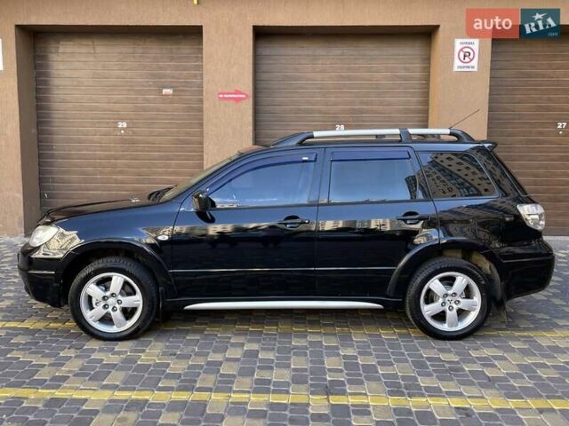Черный Мицубиси Аутлендер, объемом двигателя 2 л и пробегом 270 тыс. км за 7199 $, фото 13 на Automoto.ua