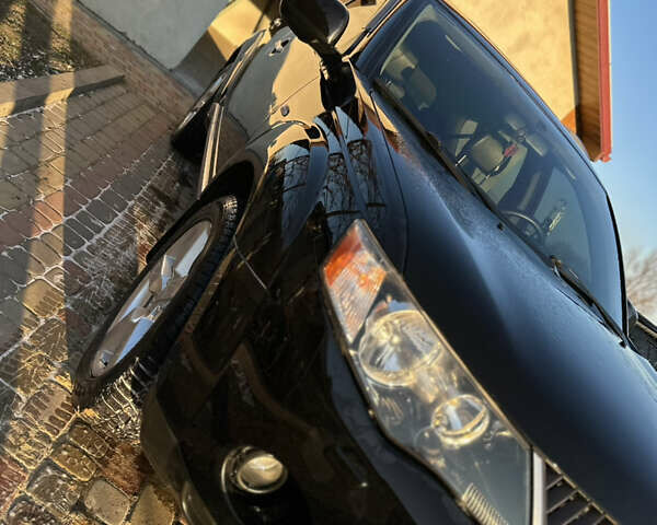 Черный Мицубиси Аутлендер, объемом двигателя 2.36 л и пробегом 253 тыс. км за 9600 $, фото 6 на Automoto.ua