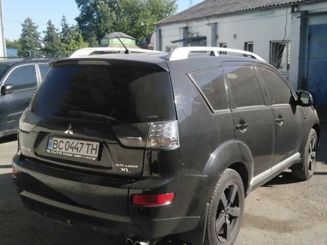 Черный Мицубиси Аутлендер, объемом двигателя 3 л и пробегом 200 тыс. км за 9500 $, фото 2 на Automoto.ua