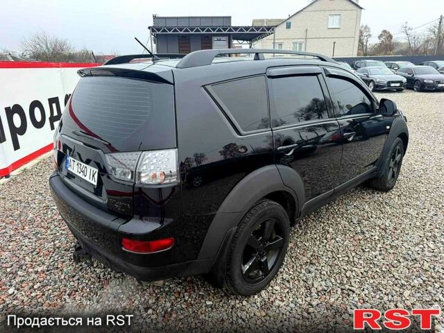 Черный Мицубиси Аутлендер, объемом двигателя 2.4 л и пробегом 200 тыс. км за 9999 $, фото 5 на Automoto.ua
