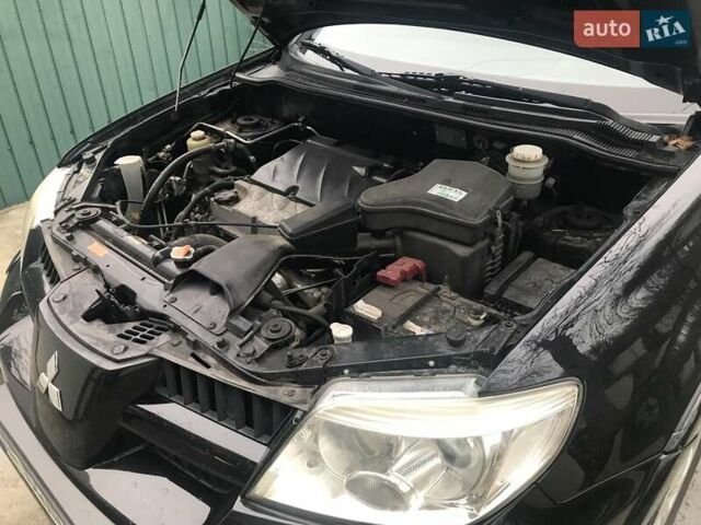 Чорний Міцубісі Аутлендер, об'ємом двигуна 2.38 л та пробігом 207 тис. км за 7000 $, фото 36 на Automoto.ua