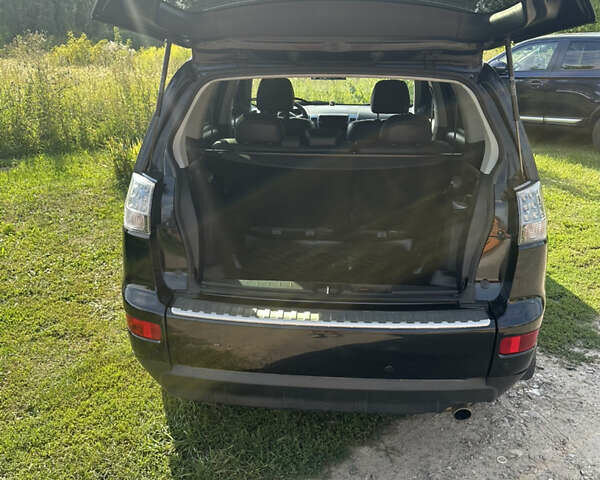 Черный Мицубиси Аутлендер, объемом двигателя 2.36 л и пробегом 240 тыс. км за 9599 $, фото 14 на Automoto.ua