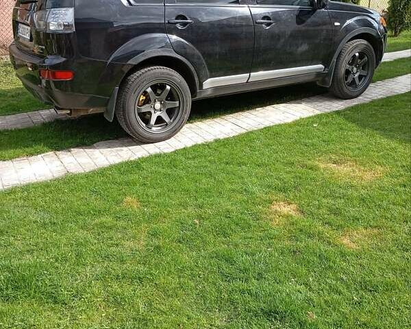 Черный Мицубиси Аутлендер, объемом двигателя 2.35 л и пробегом 245 тыс. км за 8000 $, фото 21 на Automoto.ua