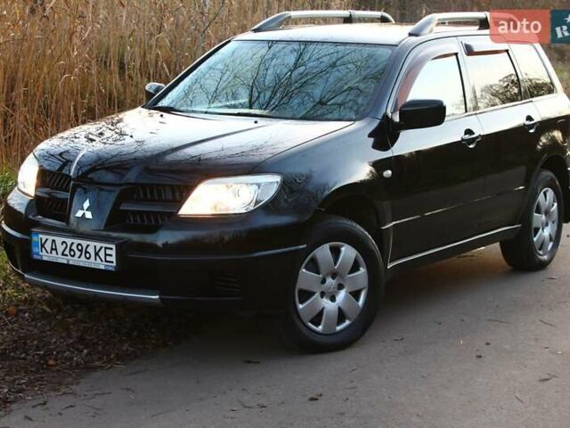 Черный Мицубиси Аутлендер, объемом двигателя 2 л и пробегом 189 тыс. км за 7200 $, фото 14 на Automoto.ua