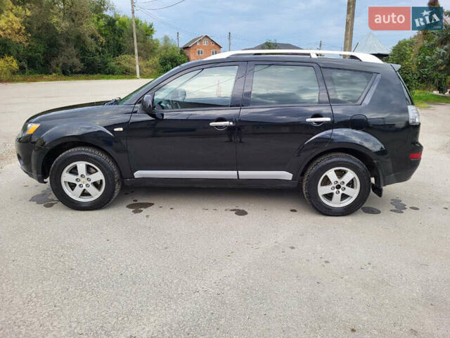 Чорний Міцубісі Аутлендер, об'ємом двигуна 2.4 л та пробігом 205 тис. км за 8400 $, фото 16 на Automoto.ua