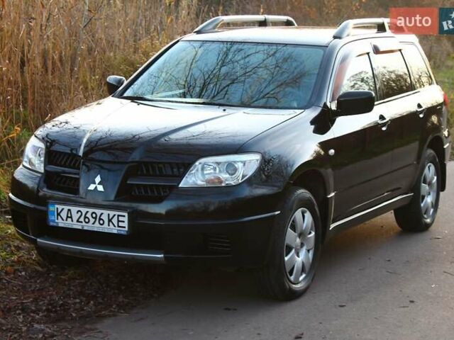 Черный Мицубиси Аутлендер, объемом двигателя 2 л и пробегом 189 тыс. км за 7200 $, фото 6 на Automoto.ua
