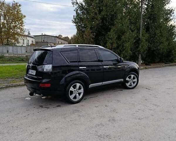 Черный Мицубиси Аутлендер, объемом двигателя 2.2 л и пробегом 200 тыс. км за 9500 $, фото 2 на Automoto.ua