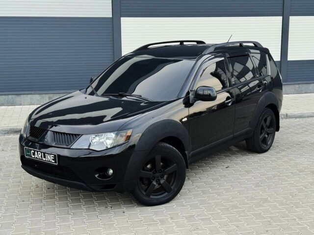 Черный Мицубиси Аутлендер, объемом двигателя 2.4 л и пробегом 199 тыс. км за 6470 $, фото 1 на Automoto.ua