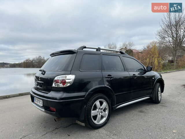 Чорний Міцубісі Аутлендер, об'ємом двигуна 2 л та пробігом 118 тис. км за 8100 $, фото 10 на Automoto.ua