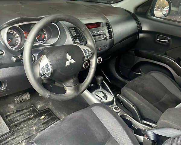 Черный Мицубиси Аутлендер, объемом двигателя 2.4 л и пробегом 199 тыс. км за 8777 $, фото 11 на Automoto.ua