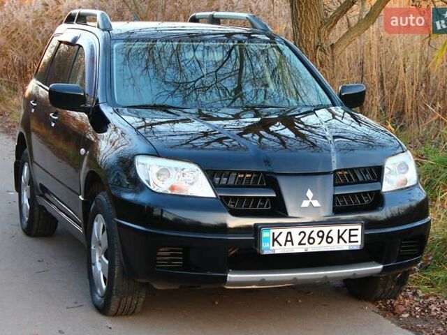 Черный Мицубиси Аутлендер, объемом двигателя 2 л и пробегом 189 тыс. км за 7200 $, фото 37 на Automoto.ua