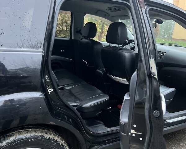 Чорний Міцубісі Аутлендер, об'ємом двигуна 2 л та пробігом 330 тис. км за 4900 $, фото 8 на Automoto.ua