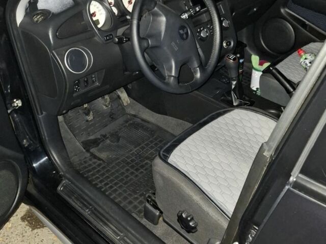 Чорний Міцубісі Аутлендер, об'ємом двигуна 2 л та пробігом 117 тис. км за 7900 $, фото 7 на Automoto.ua