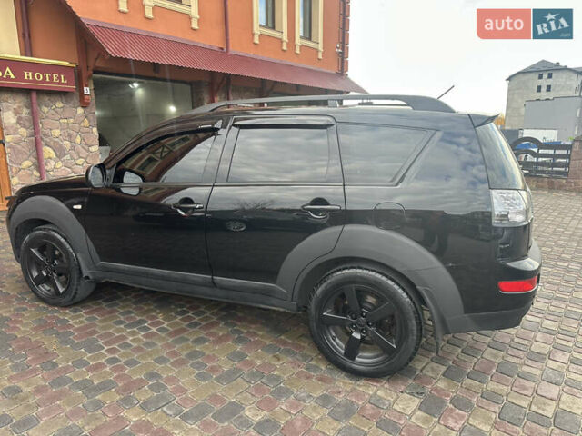 Черный Мицубиси Аутлендер, объемом двигателя 2.4 л и пробегом 199 тыс. км за 8777 $, фото 2 на Automoto.ua