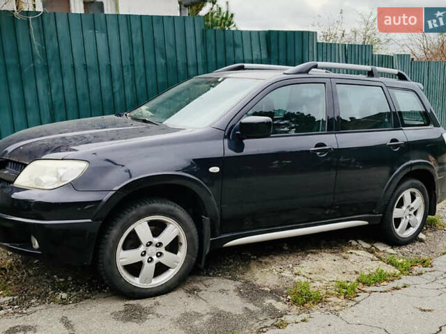 Чорний Міцубісі Аутлендер, об'ємом двигуна 2.4 л та пробігом 200 тис. км за 6790 $, фото 1 на Automoto.ua