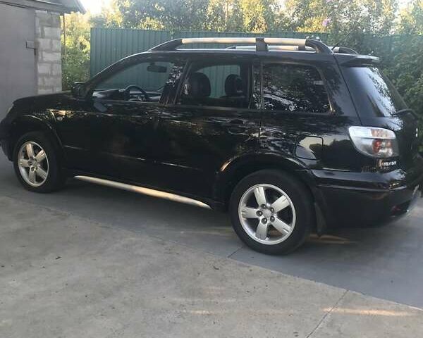 Чорний Міцубісі Аутлендер, об'ємом двигуна 2.38 л та пробігом 207 тис. км за 7000 $, фото 61 на Automoto.ua