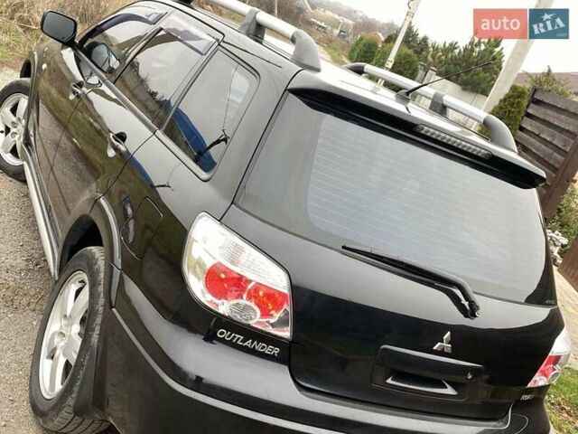 Черный Мицубиси Аутлендер, объемом двигателя 2.4 л и пробегом 178 тыс. км за 6900 $, фото 24 на Automoto.ua