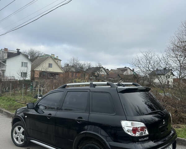 Чорний Міцубісі Аутлендер, об'ємом двигуна 2 л та пробігом 118 тис. км за 8100 $, фото 15 на Automoto.ua