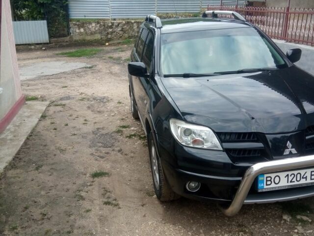 Чорний Міцубісі Аутлендер, об'ємом двигуна 2 л та пробігом 208 тис. км за 6700 $, фото 11 на Automoto.ua