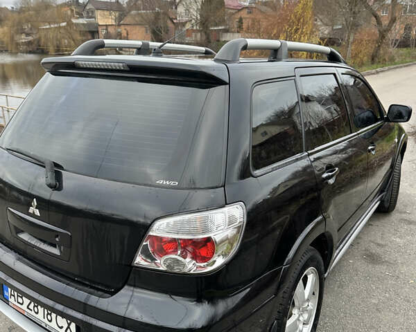 Чорний Міцубісі Аутлендер, об'ємом двигуна 2 л та пробігом 118 тис. км за 8100 $, фото 11 на Automoto.ua