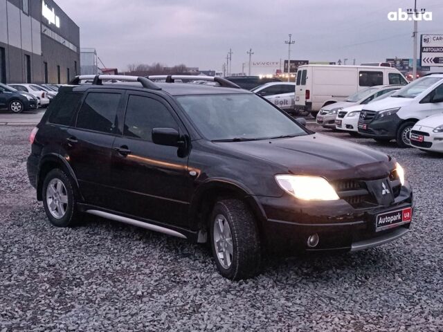 Черный Мицубиси Аутлендер, объемом двигателя 2 л и пробегом 271 тыс. км за 6940 $, фото 11 на Automoto.ua