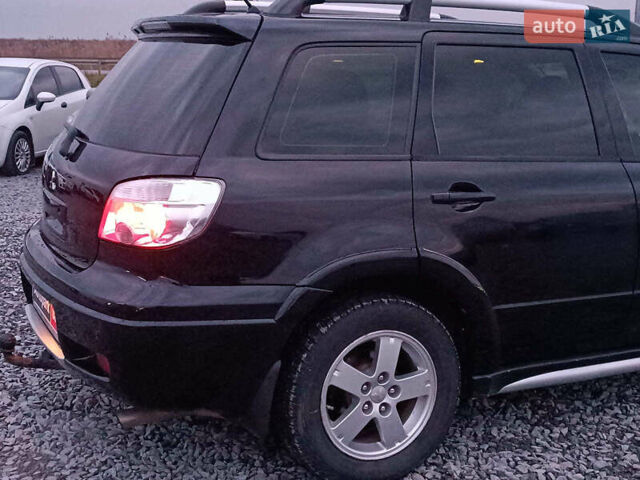 Чорний Міцубісі Аутлендер, об'ємом двигуна 2 л та пробігом 271 тис. км за 6940 $, фото 9 на Automoto.ua