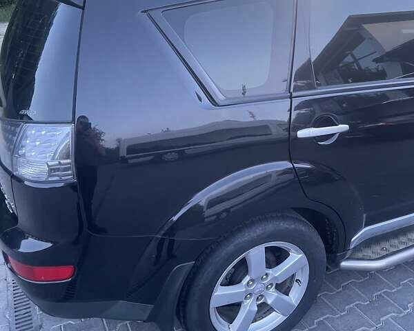 Черный Мицубиси Аутлендер, объемом двигателя 2.4 л и пробегом 290 тыс. км за 9500 $, фото 7 на Automoto.ua