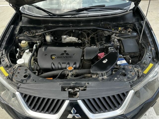 Чорний Міцубісі Аутлендер, об'ємом двигуна 2.4 л та пробігом 137 тис. км за 8700 $, фото 14 на Automoto.ua