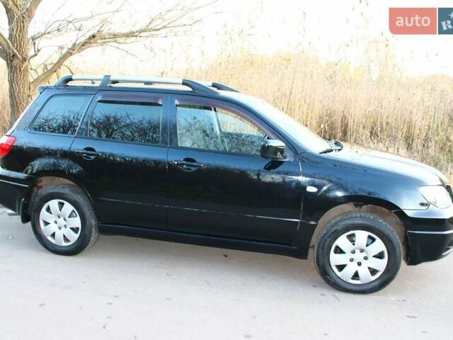 Черный Мицубиси Аутлендер, объемом двигателя 2 л и пробегом 189 тыс. км за 7200 $, фото 35 на Automoto.ua