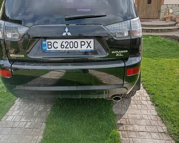 Черный Мицубиси Аутлендер, объемом двигателя 2.35 л и пробегом 245 тыс. км за 8000 $, фото 20 на Automoto.ua