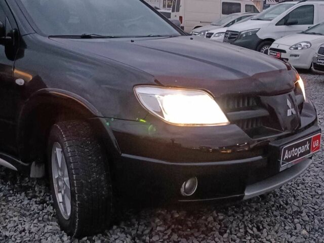 Черный Мицубиси Аутлендер, объемом двигателя 2 л и пробегом 271 тыс. км за 6940 $, фото 12 на Automoto.ua